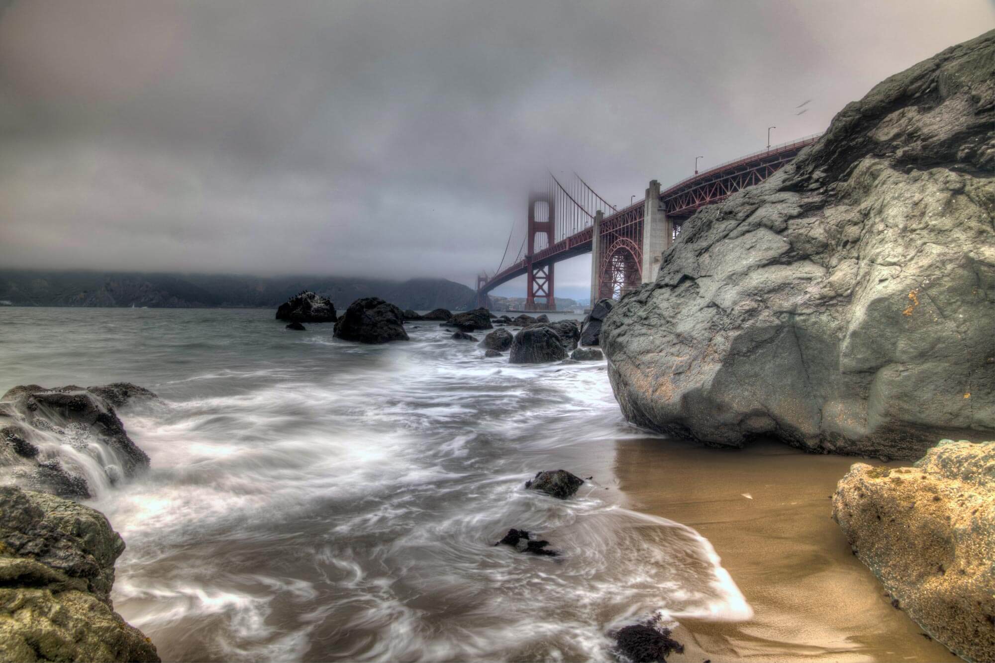 Golden Gate Bridge, rocks and tide at Marshalls Beach